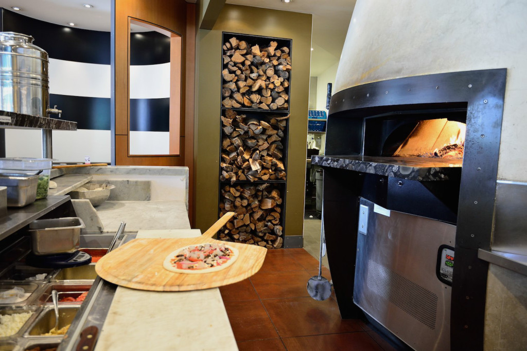 The wood-fired oven is the centerpiece of the kitchen.