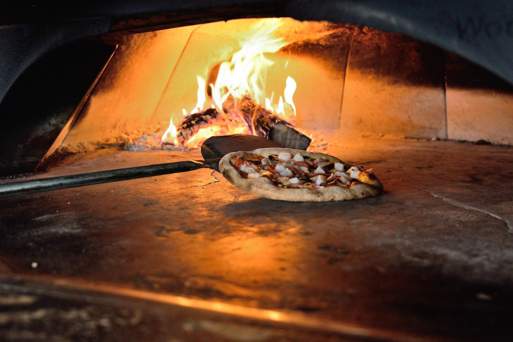 The oven is kept around 600 degrees and can finish cooking a pizza in about five minutes, according to executive chef Trent Campbell.