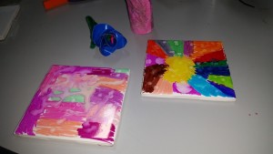 Examples of art tiles, duct tape rose, tea lamps and laser wands.